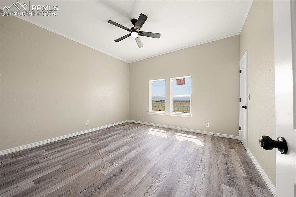 8160 Edison Road Yoder, CO 80864 - Photo 26 of 42 wooden floor in an empty room with a window