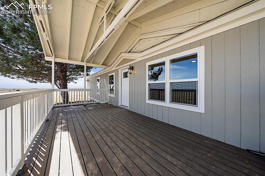 8160 Edison Road Yoder, CO 80864 - Photo 3 of 42 a view of deck with wooden floor and fence