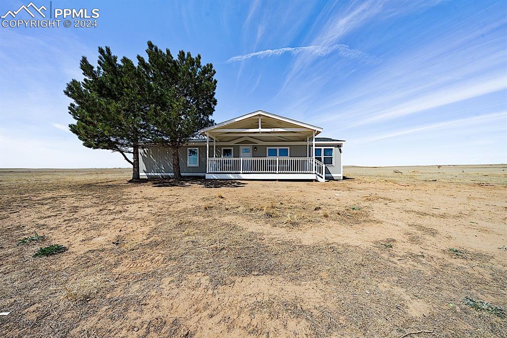 8160 Edison Road Yoder, CO 80864 - Photo 33 of 42 a front view of a house with a yard