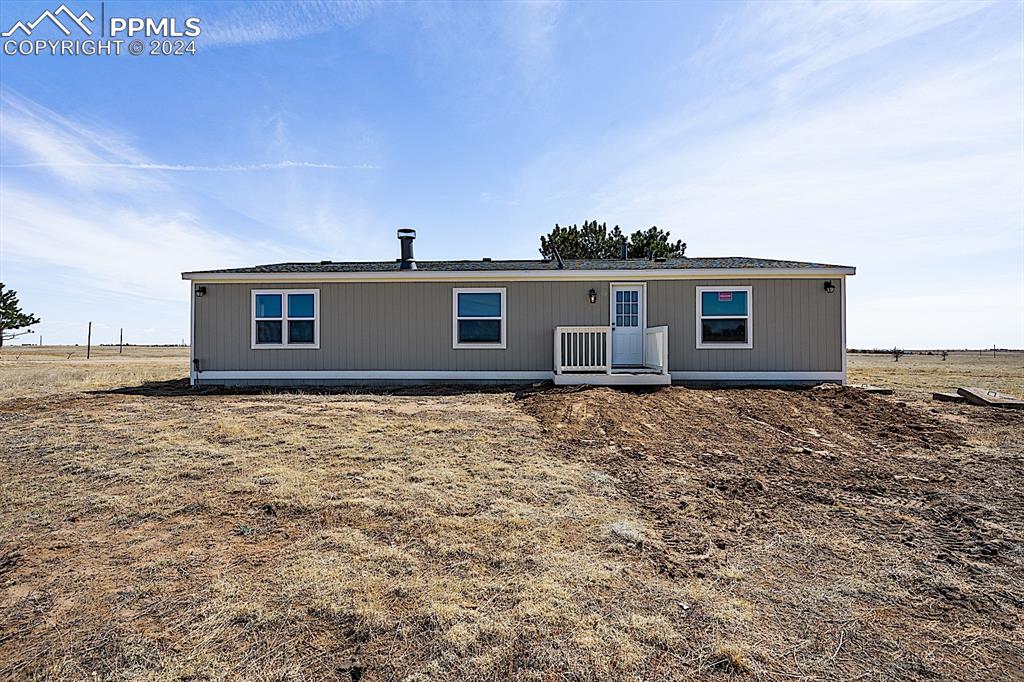 8160 Edison Road Yoder, CO 80864 - Photo 39 of 42 a front view of a house with a garden