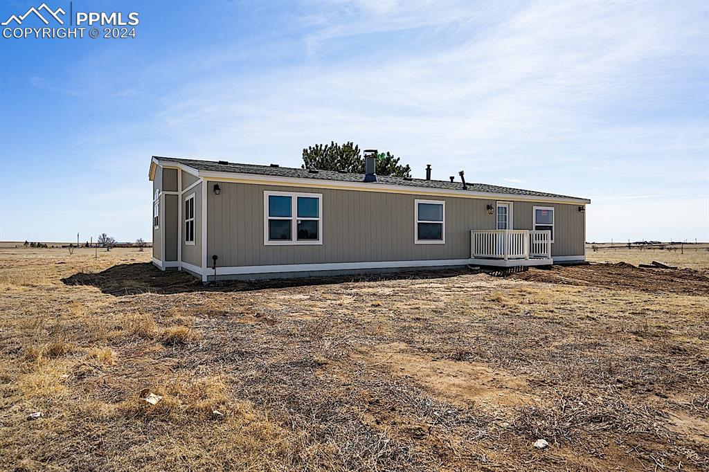 8160 Edison Road Yoder, CO 80864 - Photo 40 of 42 a house view with a garden