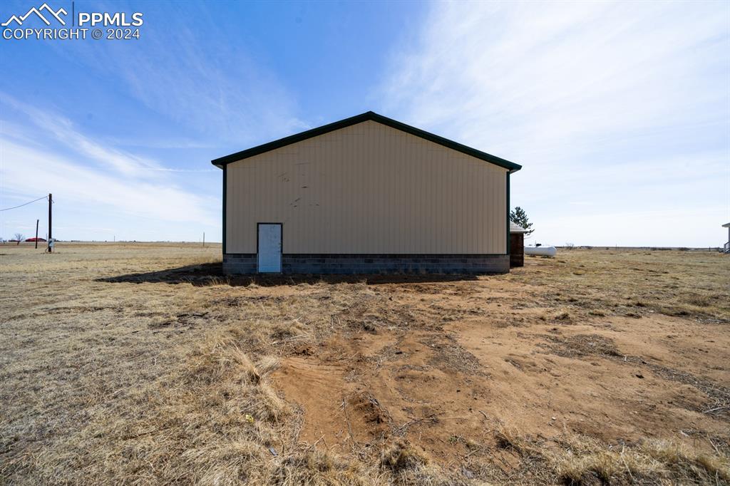 8160 Edison Road Yoder, CO 80864 - Photo 41 of 42 a view of a wooden house with an outdoor space