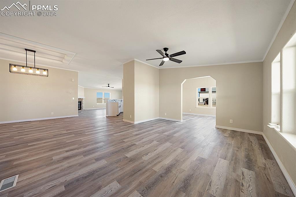 8160 Edison Road Yoder, CO 80864 - Photo 8 of 42 a view of empty room with wooden floor and window