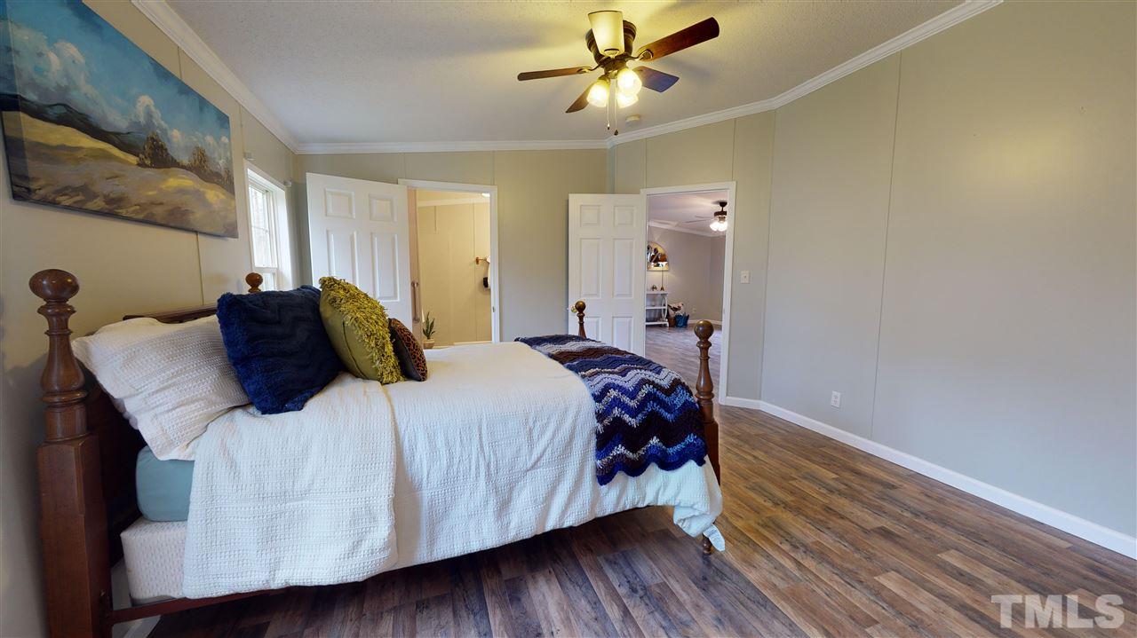 6603 Russell Road Durham, NC 27712 - Photo 9 of 30 Master Suite features spacious WIC & en-suite bathroom w/ dual vanity & walk-in-shower.