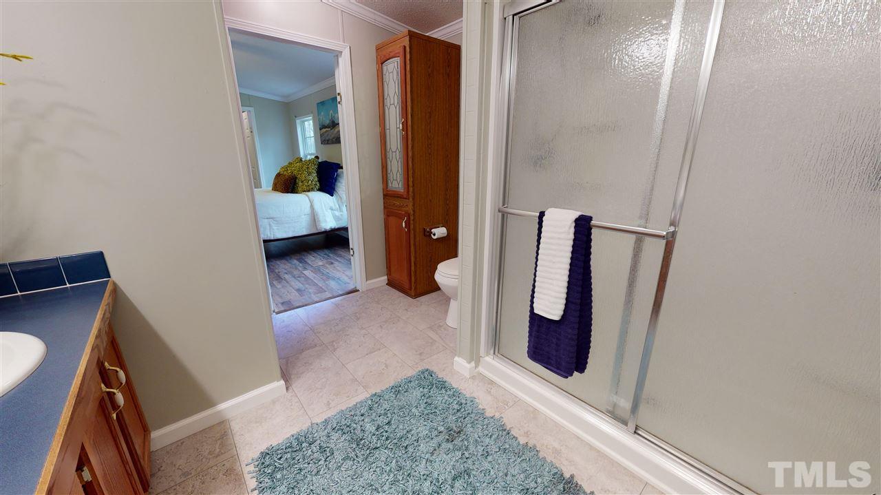 6603 Russell Road Durham, NC 27712 - Photo 11 of 30 Master Suite features spacious WIC & en-suite bathroom w/ dual vanity & walk-in-shower.