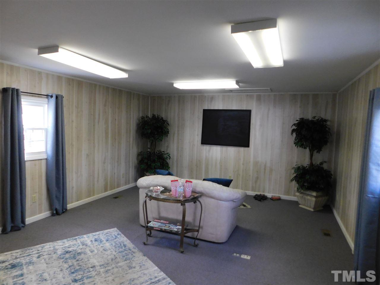 6603 Russell Road Durham, NC 27712 - Photo 21 of 30 618sqft detached flex space (heated/cooled) ideal for office & small business owner or added recreation space/game room!