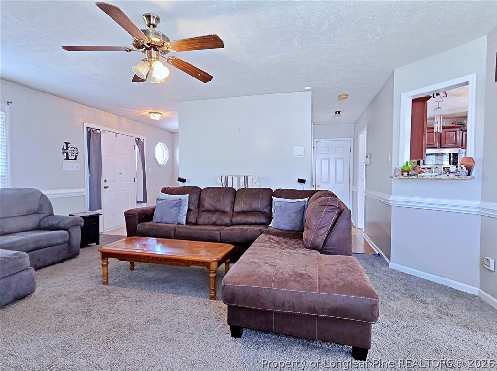 5218 Pringle Way Hope Mills, NC 28348 - Photo 9 of 43 a living room with furniture and a ceiling fan