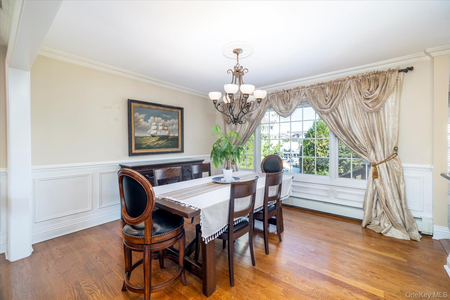2863 Harbor Road Merrick, NY 11566 - Photo 12 of 35 a view of a dining room with furniture window and wooden floor