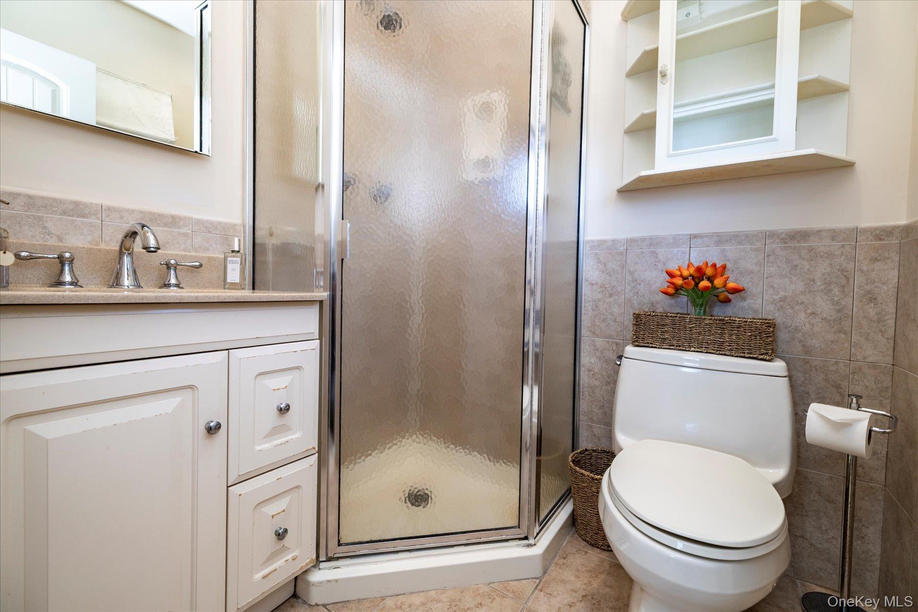 2863 Harbor Road Merrick, NY 11566 - Photo 14 of 35 a bathroom with a toilet and a sink