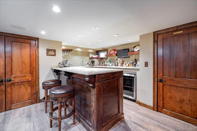 a kitchen with a refrigerator and a table
