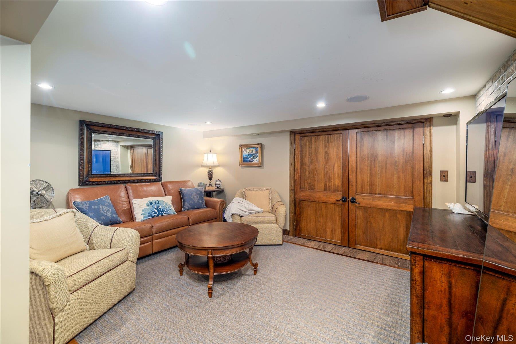 2863 Harbor Road Merrick, NY 11566 - Photo 25 of 35 a living room with furniture and a gate