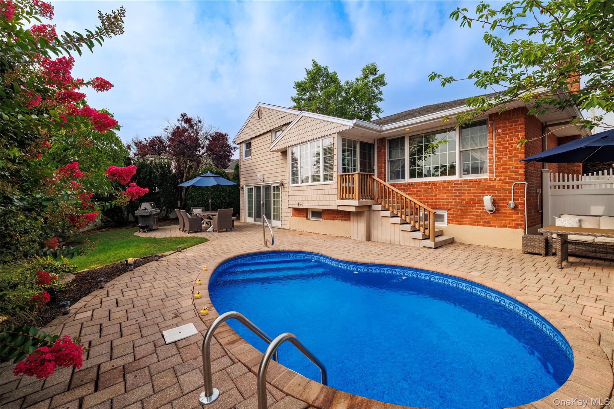 2863 Harbor Road Merrick, NY 11566 - Photo 27 of 35 a view of a house with backyard and sitting area