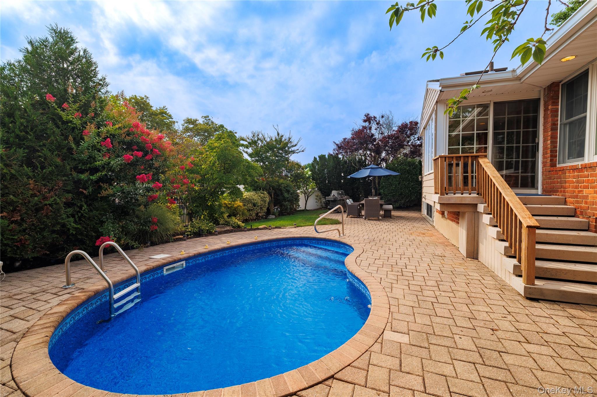 2863 Harbor Road Merrick, NY 11566 - Photo 28 of 35 a view of a swimming pool with lounge chair