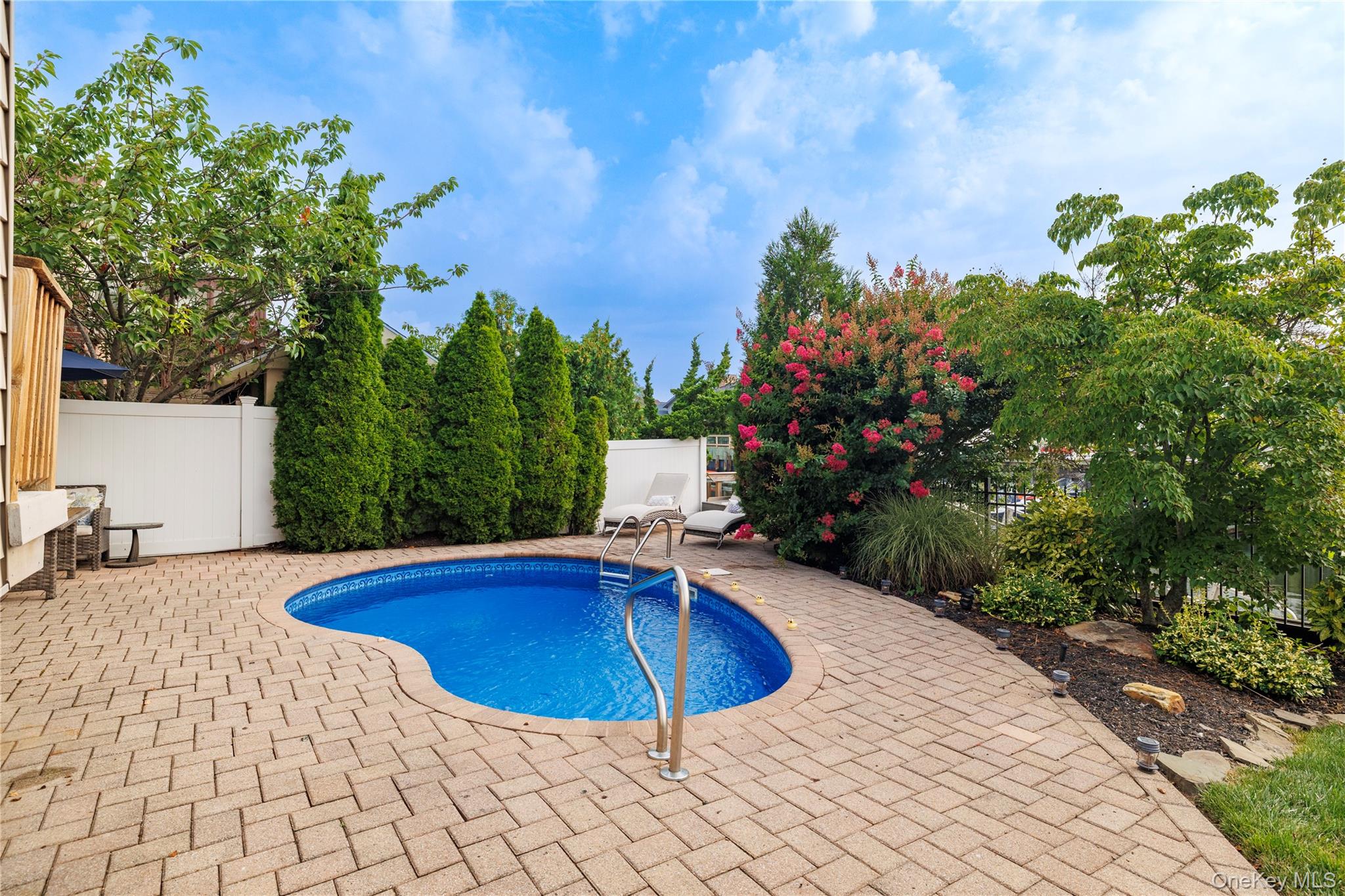 2863 Harbor Road Merrick, NY 11566 - Photo 29 of 35 a view of a swimming pool with a patio