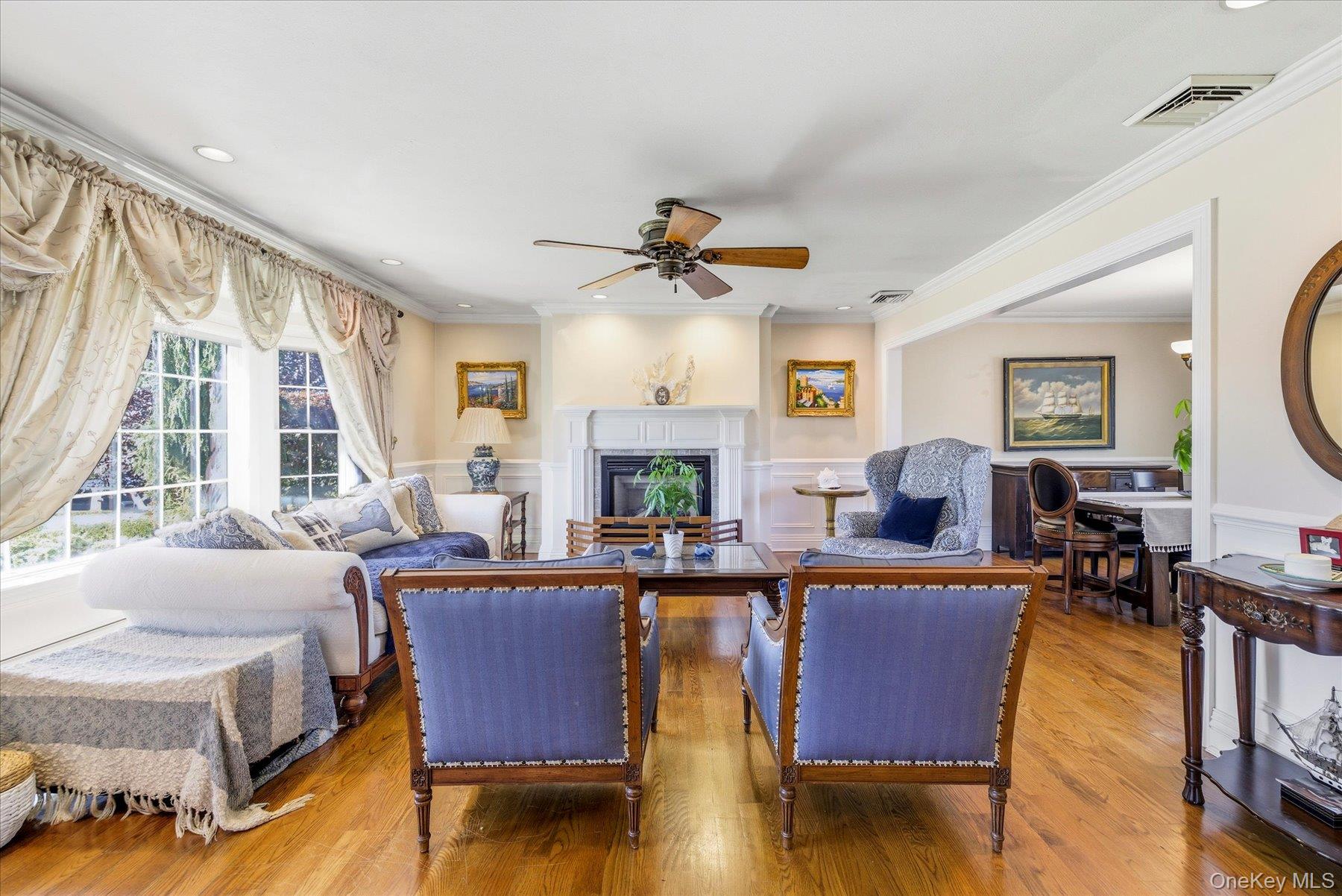 2863 Harbor Road Merrick, NY 11566 - Photo 5 of 35 a living room with fireplace furniture and a large window