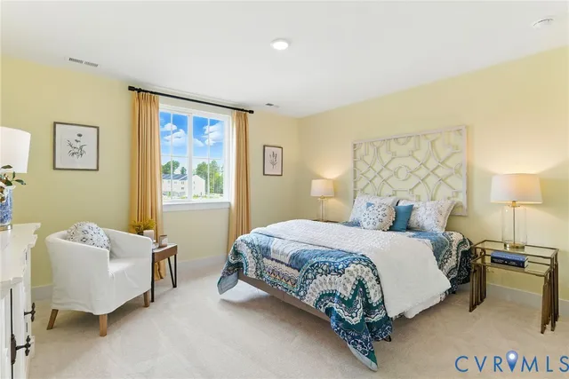 a bedroom with a bed and a couch