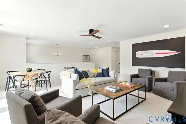 a living room with furniture and a lamp