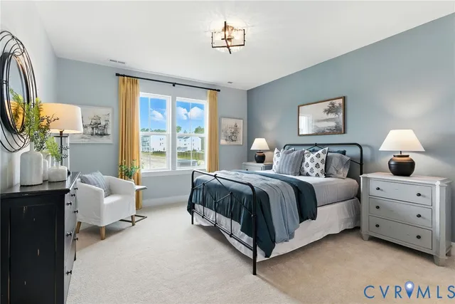 a spacious bedroom with a bed and a window