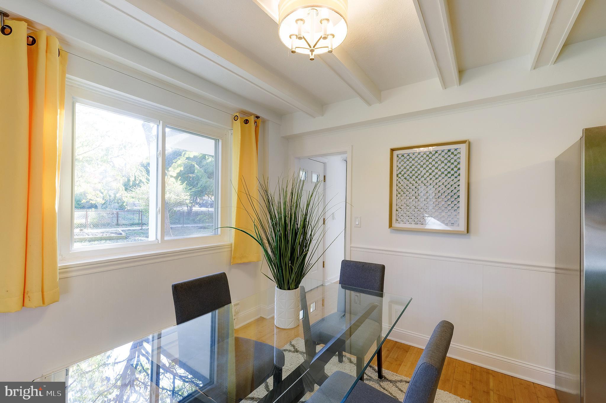 10 Hillside Road Greenbelt, MD 20770 - Photo 17 of 50 a view of a dining room with furniture window and outside view