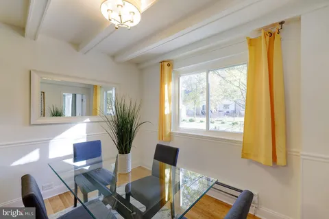 a view of a livingroom with furniture and a potted plant