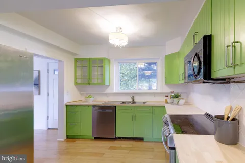 a kitchen with a sink and cabinets