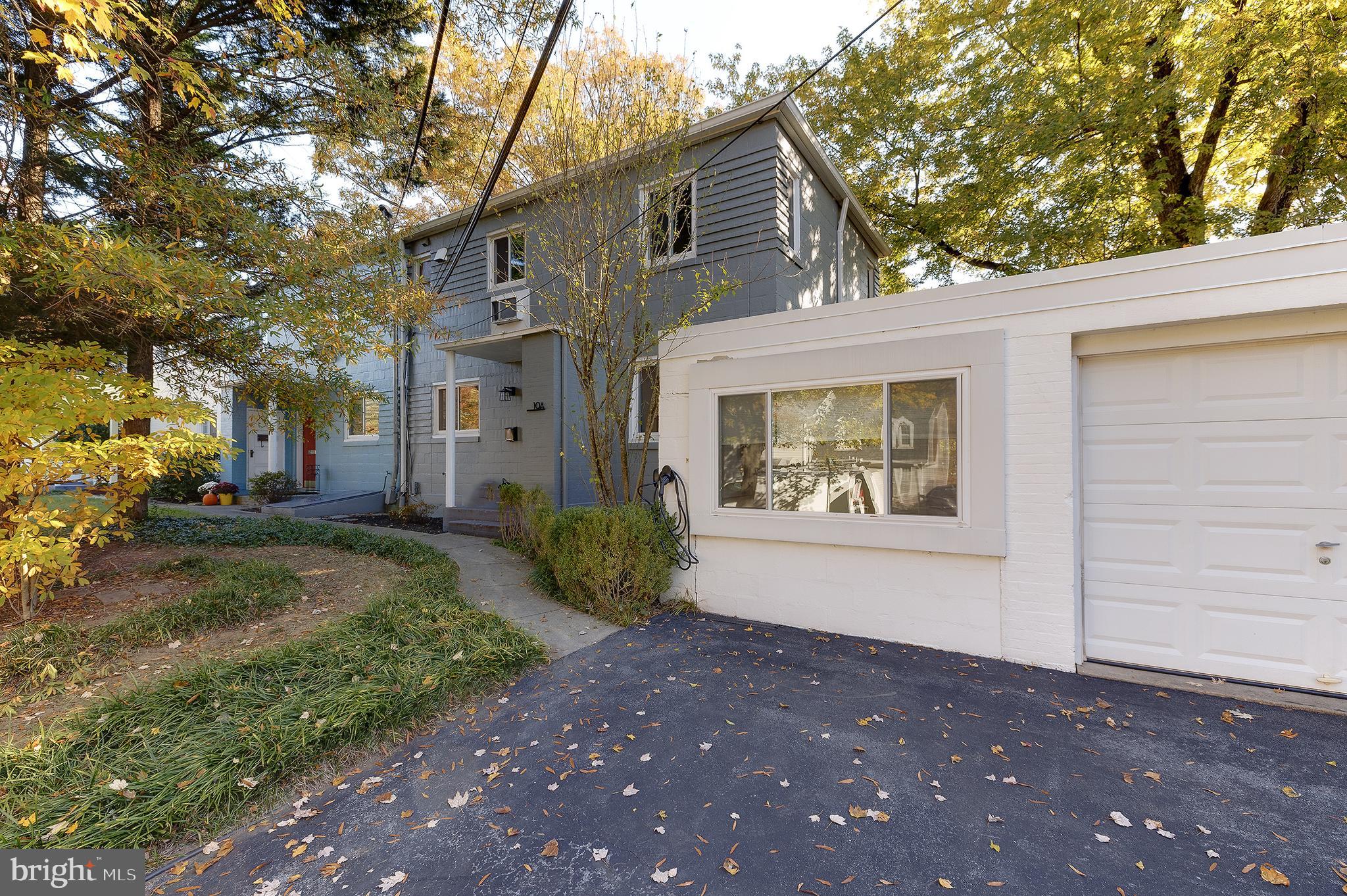 10 Hillside Road Greenbelt, MD 20770 - Photo 2 of 50 a front view of a house with a yard and garage