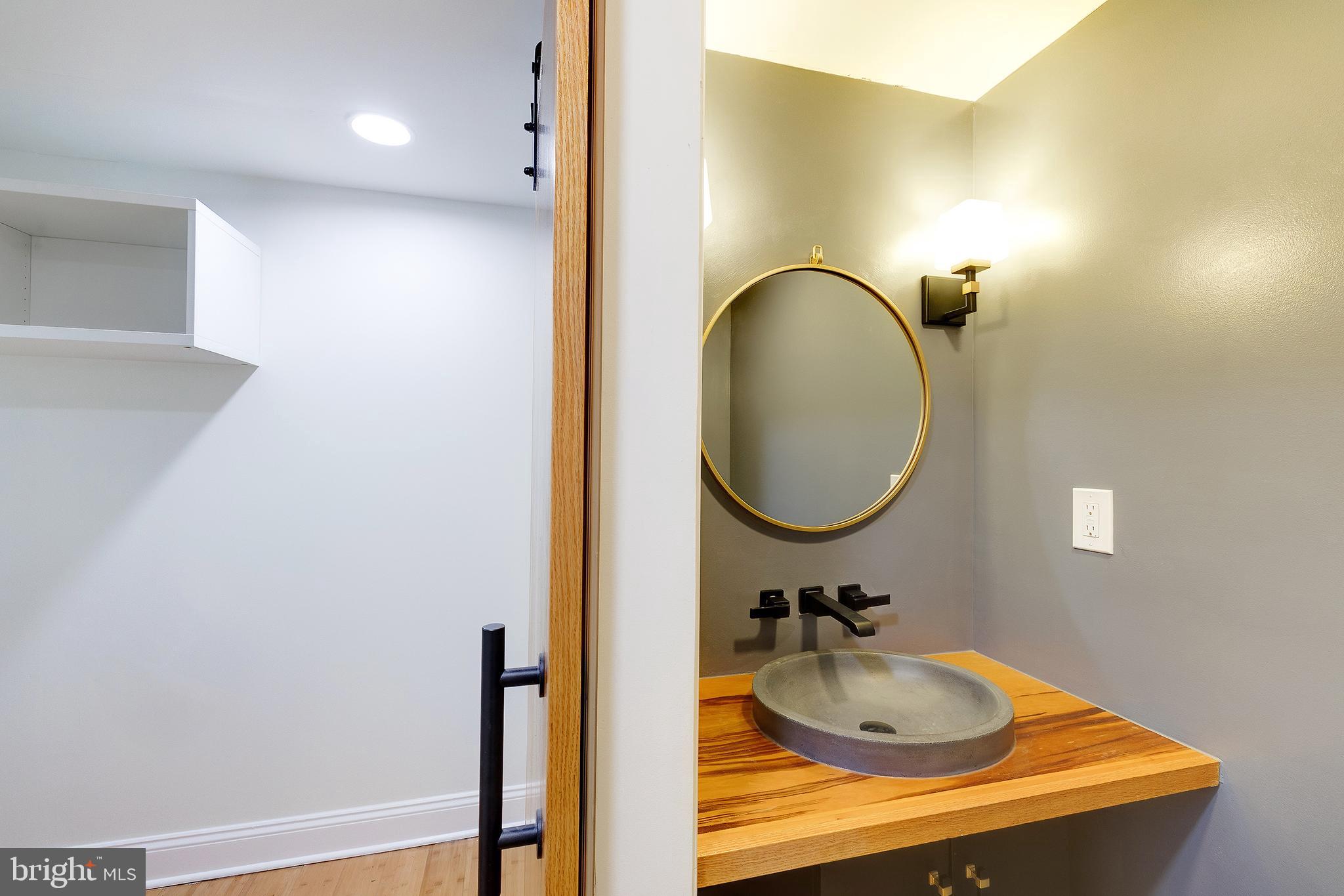 10 Hillside Road Greenbelt, MD 20770 - Photo 28 of 50 a bathroom with a sink and a mirror