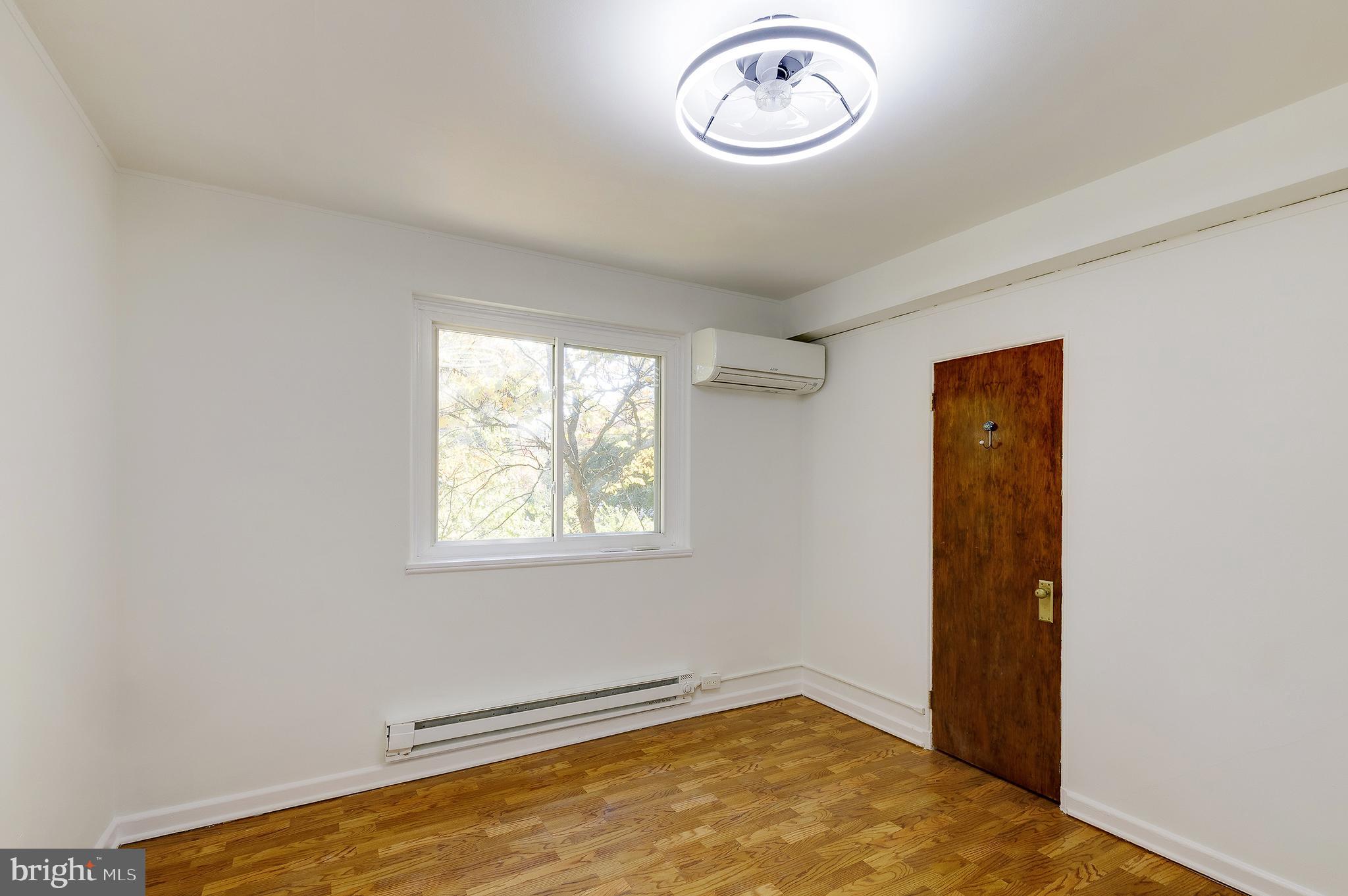 10 Hillside Road Greenbelt, MD 20770 - Photo 42 of 50 an empty room with windows