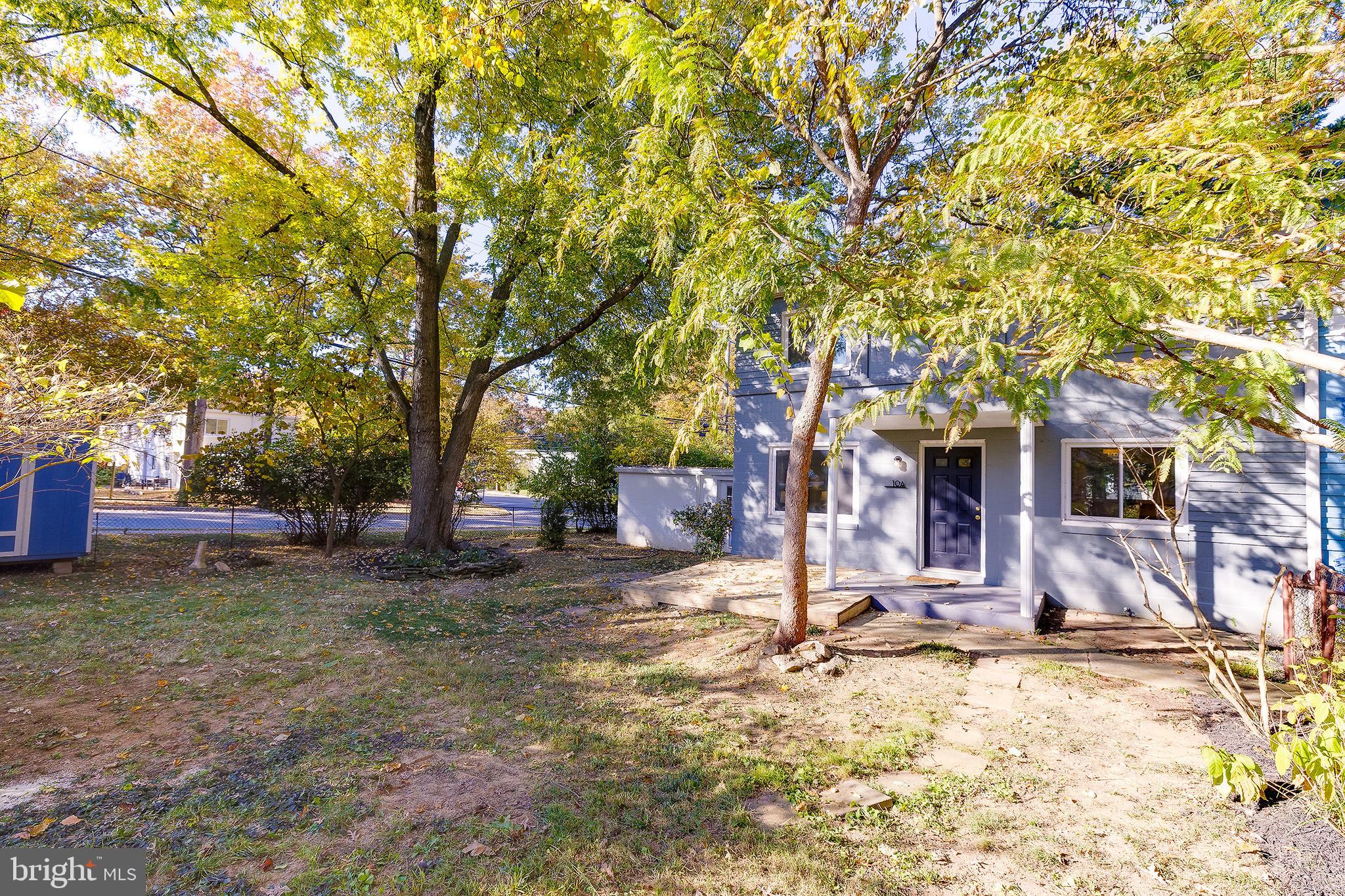 10 Hillside Road Greenbelt, MD 20770 - Photo 7 of 50 a view of a house with a yard covered in snow