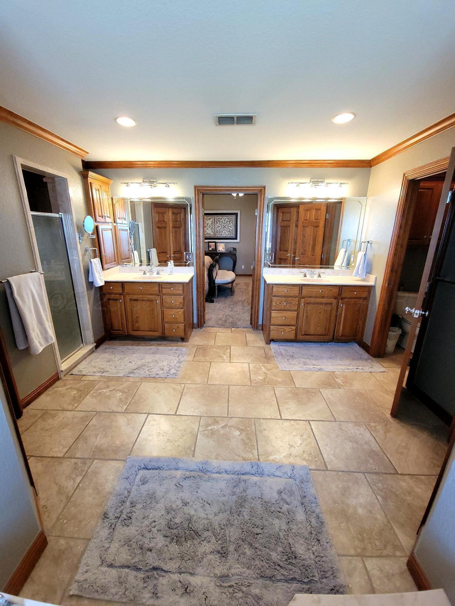 14355 Southeast Se Loop Perryton, TX 79070 - Photo 13 of 33 a living room with a couch and a flat screen tv