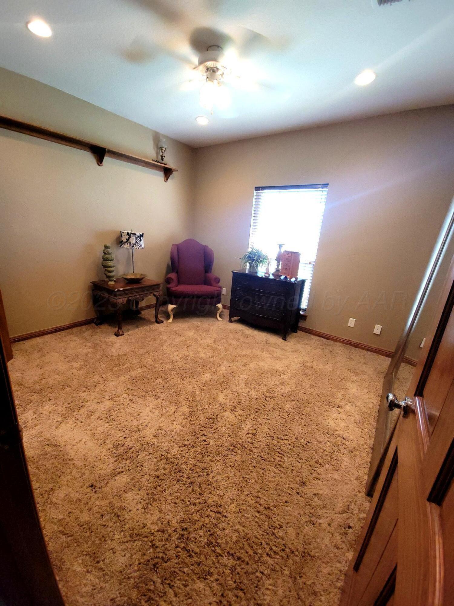 14355 Southeast Se Loop Perryton, TX 79070 - Photo 15 of 33 a bed room with furniture and a window