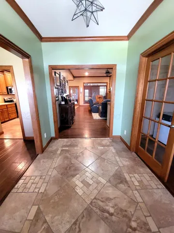 a view of a livingroom with furniture and a window