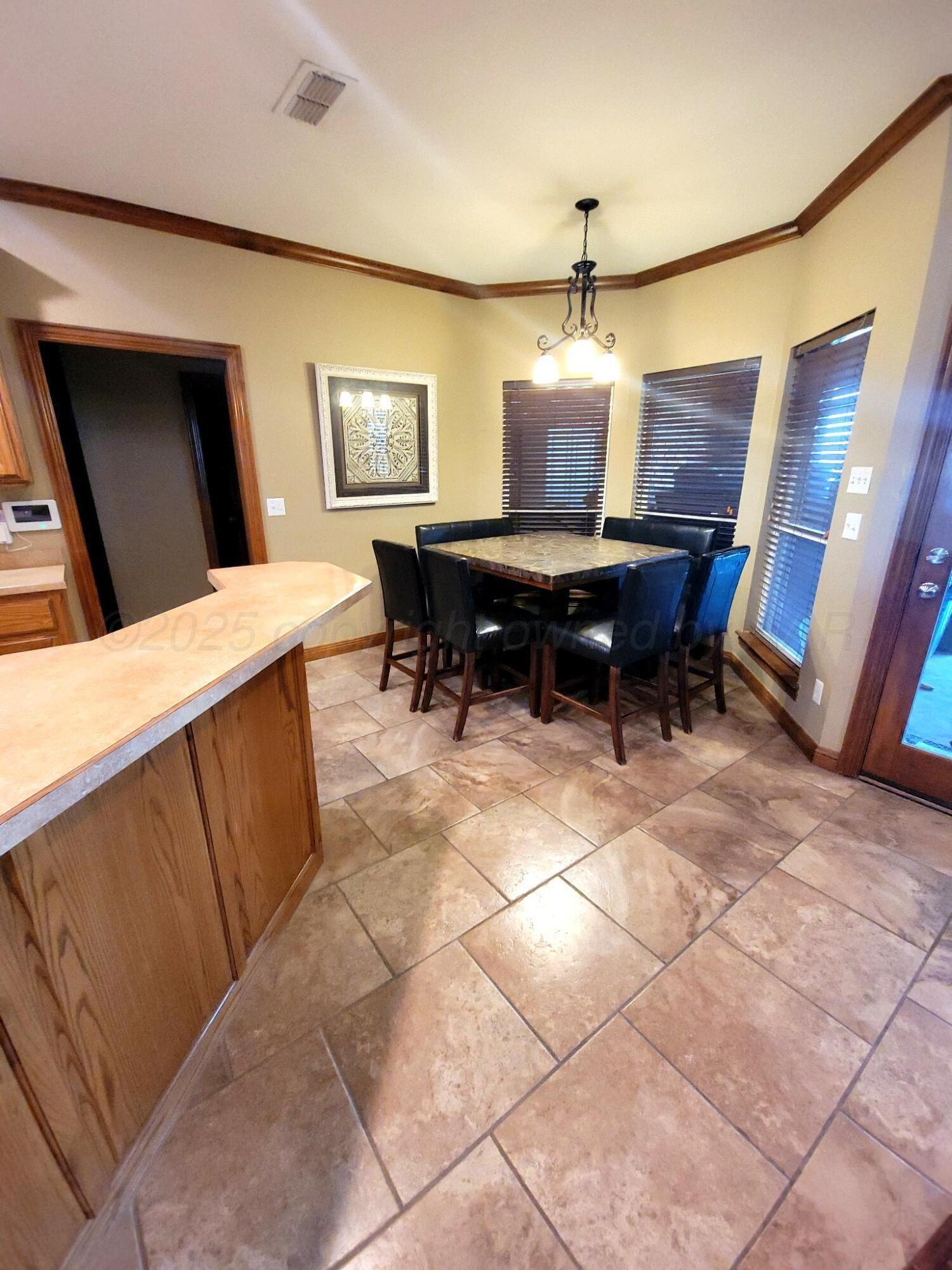 14355 Southeast Se Loop Perryton, TX 79070 - Photo 9 of 33 a living room with furniture a dining table and a piano table