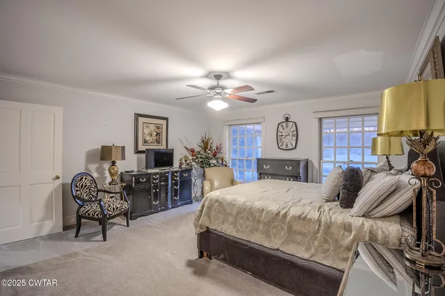 a living room with furniture and a mirror