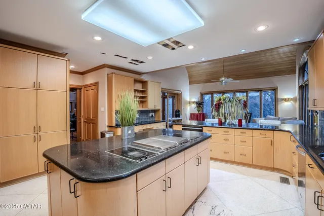 a dining room with furniture a chandelier and a rug