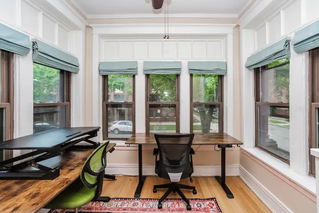 a work room with furniture and a window