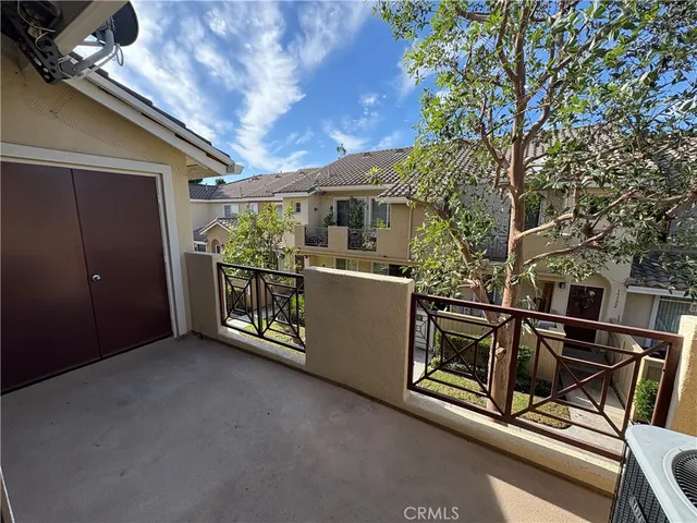 a view of a white building with large windows