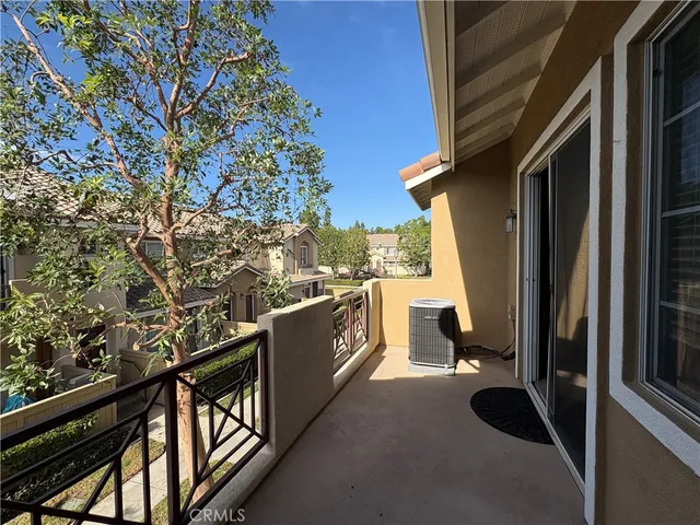 a view of house with a trees in the background