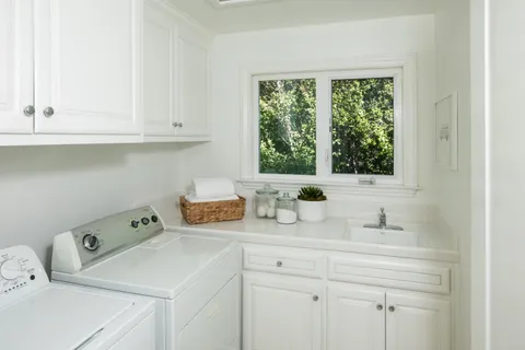 a bathroom with a sink and a window