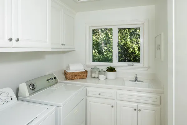 a bathroom with a sink and a window