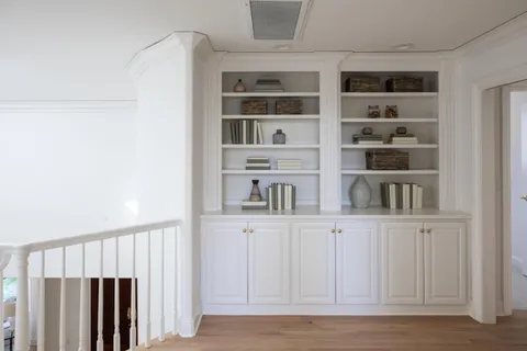 a view of wooden floor and windows in a kitchen