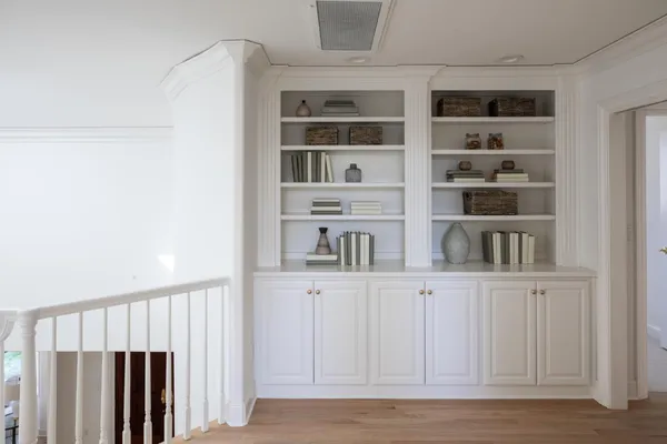 a view of wooden floor and windows in a kitchen