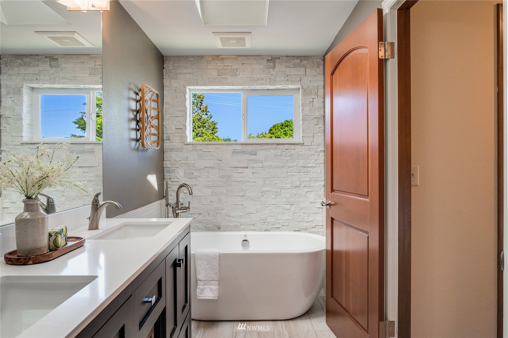 548 North 75th Street Seattle, WA 98103 - Photo 11 of 39 a bathroom with a tub and a sink