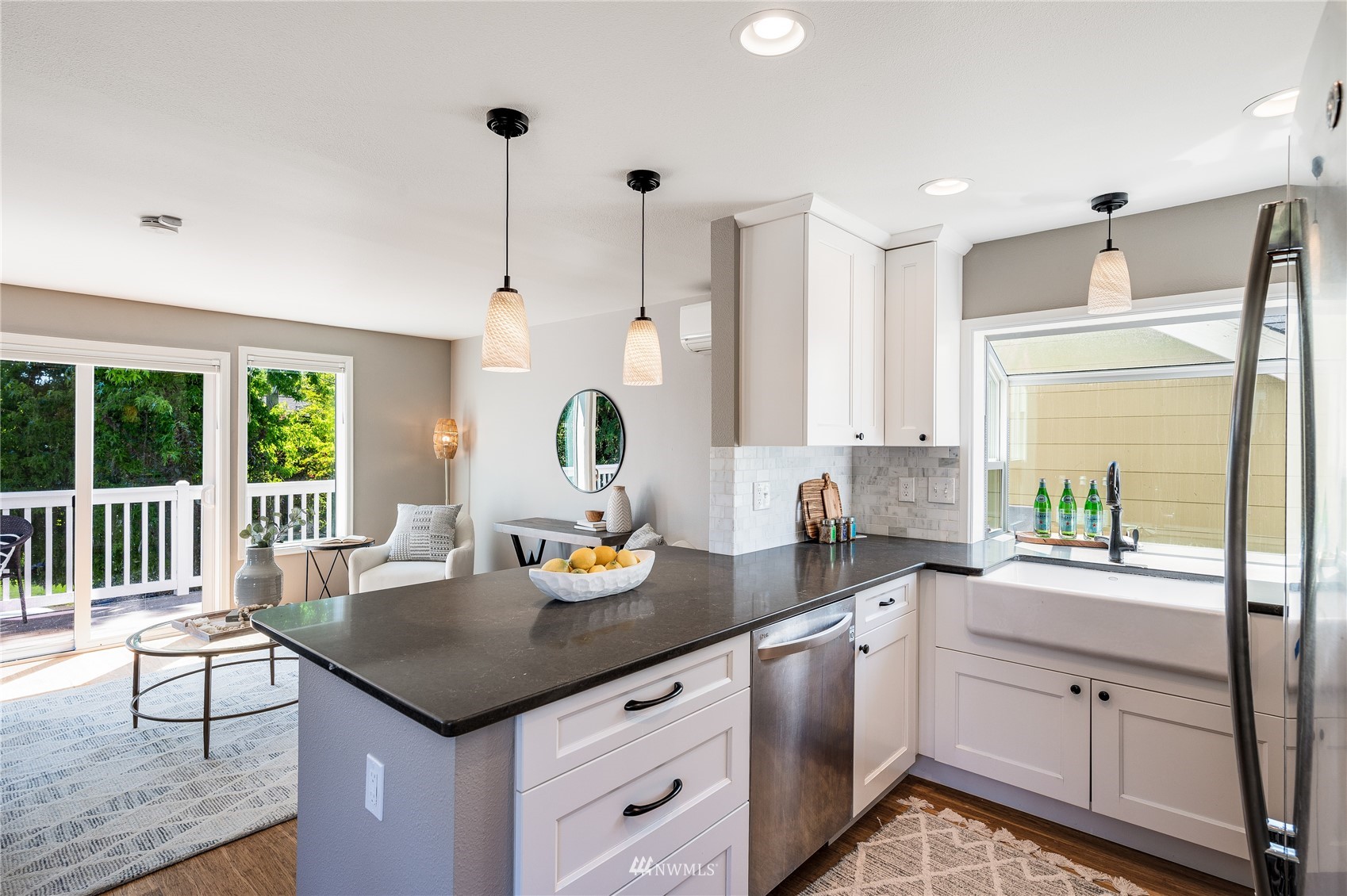 548 North 75th Street Seattle, WA 98103 - Photo 12 of 39 a kitchen with a sink stove and cabinets