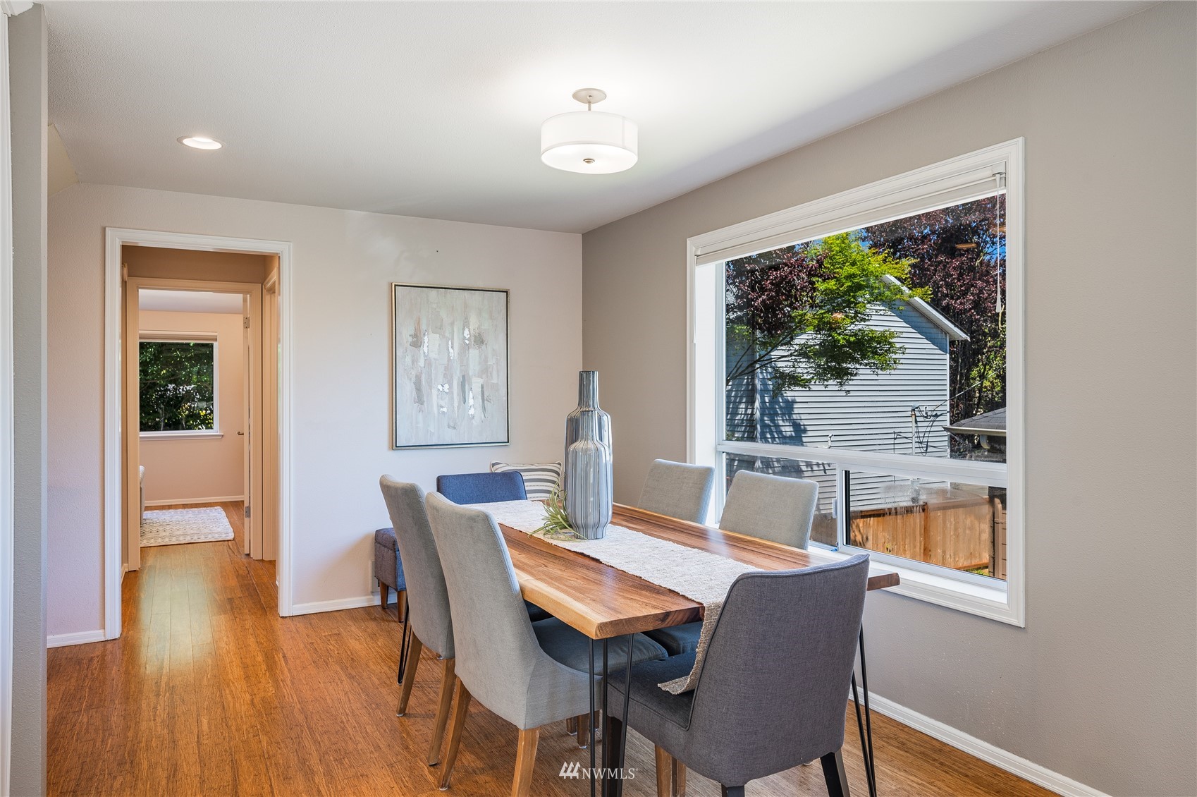 548 North 75th Street Seattle, WA 98103 - Photo 22 of 39 a view of a dining room with furniture window and wooden floor