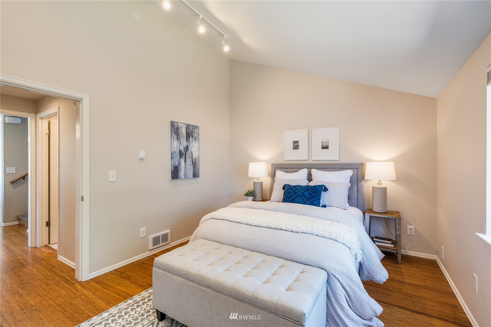 548 North 75th Street Seattle, WA 98103 - Photo 25 of 39 a bedroom with a bed and a painting on the wall