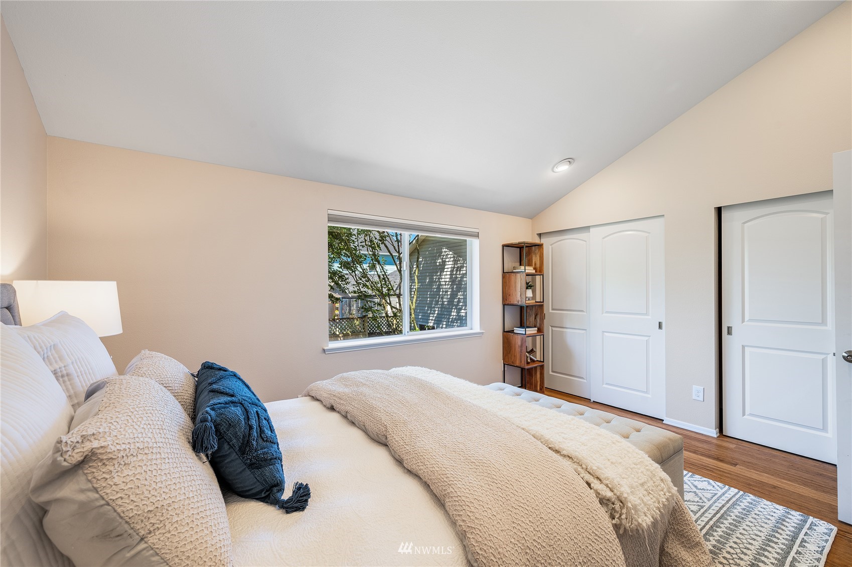 548 North 75th Street Seattle, WA 98103 - Photo 26 of 39 a bed room with a bed and a window