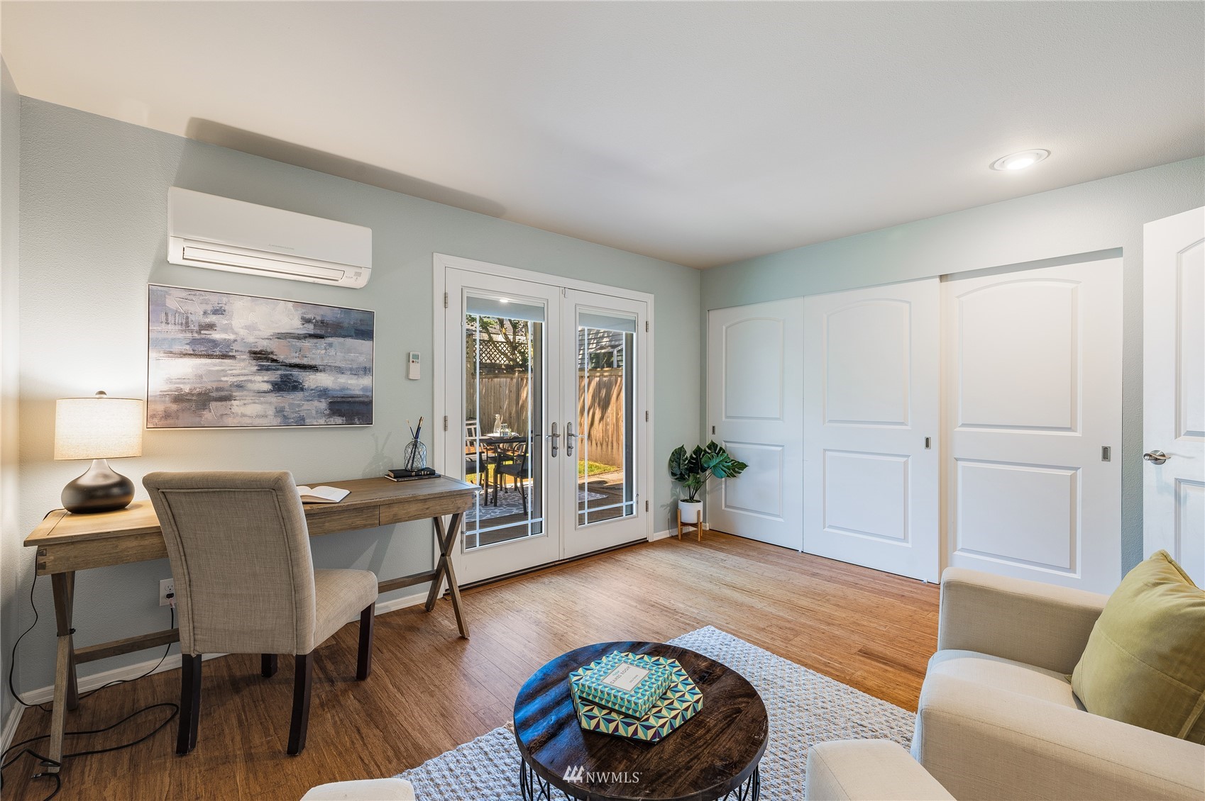 548 North 75th Street Seattle, WA 98103 - Photo 29 of 39 a living room with furniture and a wooden floor