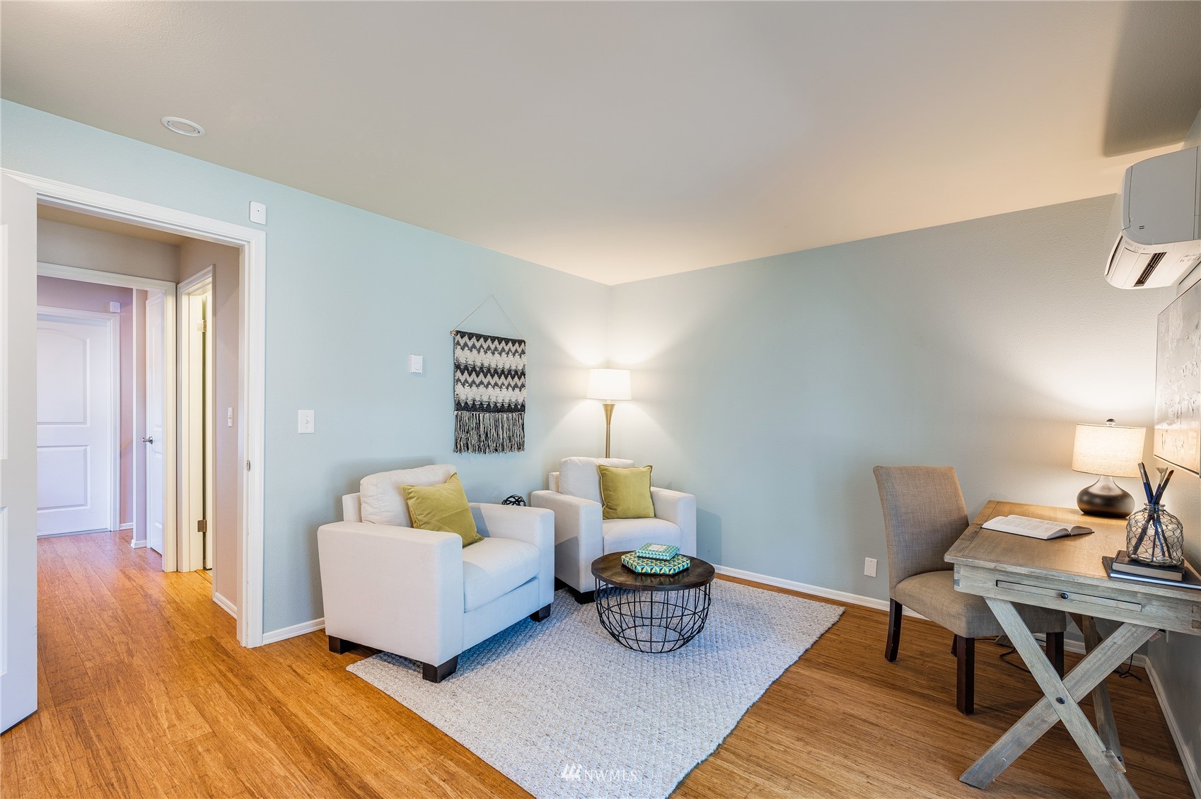 548 North 75th Street Seattle, WA 98103 - Photo 30 of 39 a living room with furniture and wooden floor