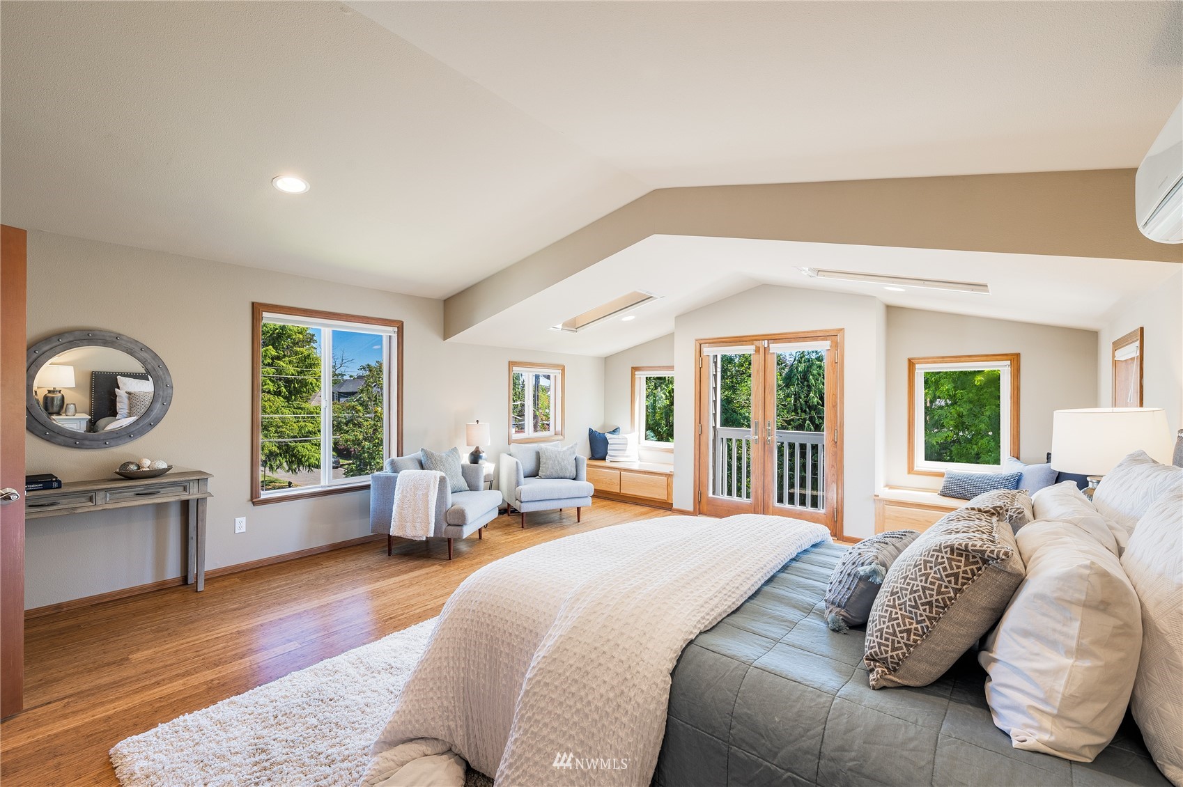 548 North 75th Street Seattle, WA 98103 - Photo 3 of 39 a spacious bedroom with a large bed and a large window